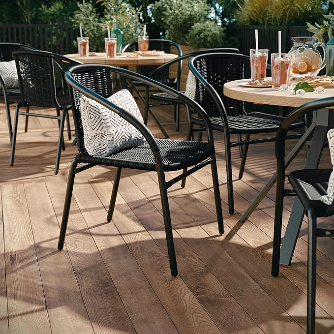 EMMA + OLIVER Set of 4 Modern Rattan Indoor/Outdoor Stack Chairs, Stacking Rattan Patio Chairs with Curved Back and Cross Bracing, Black